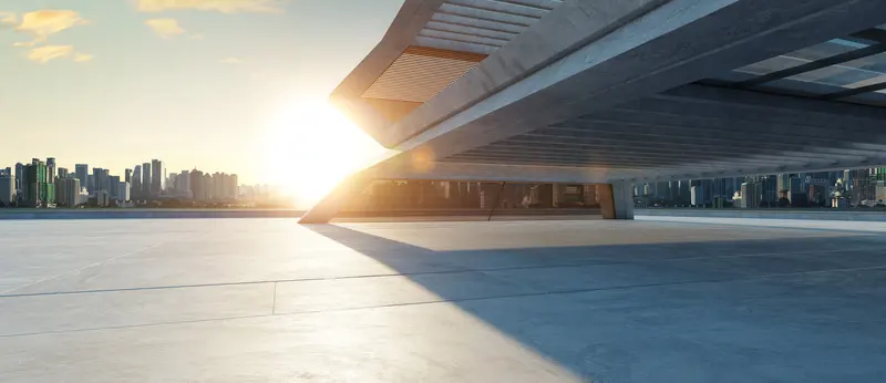 A contemporary architectural canopy at sunset